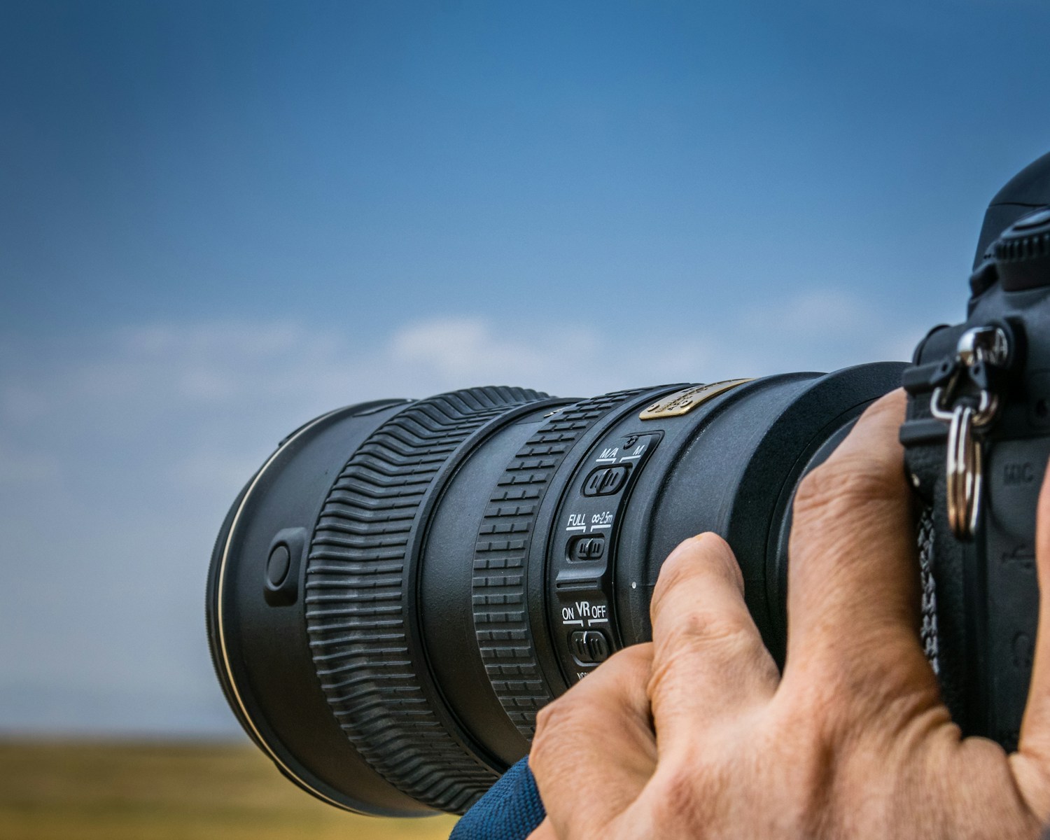 person using black DSLR camera